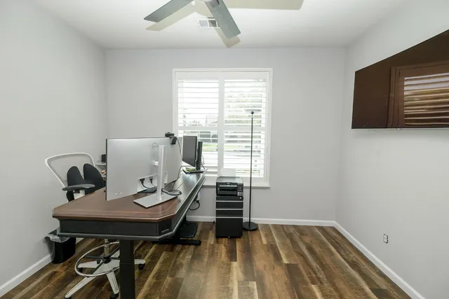 a bathroom with a sink a toilet a mirror and shower