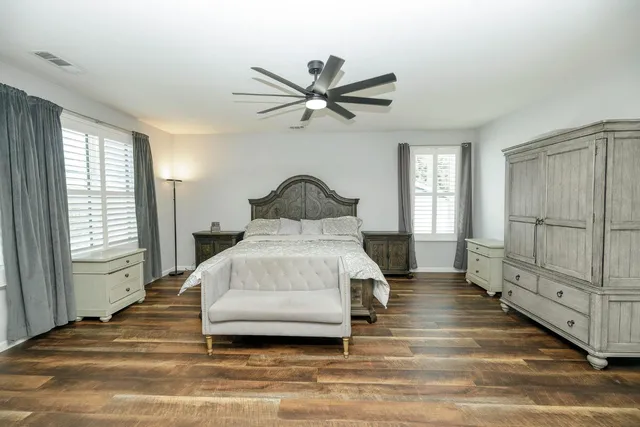 a backyard of a house with lots of green space and outdoor seating