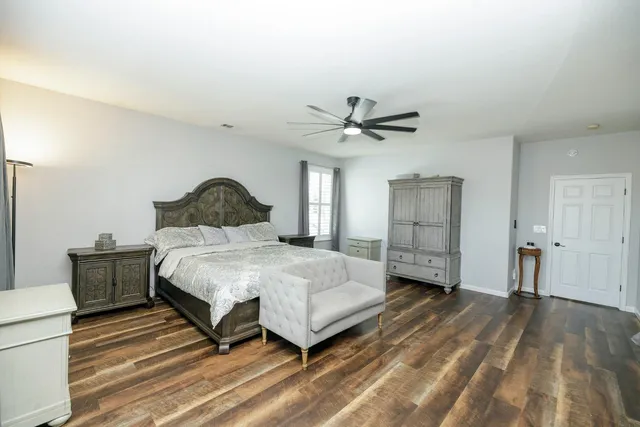 a view of a backyard with sitting area