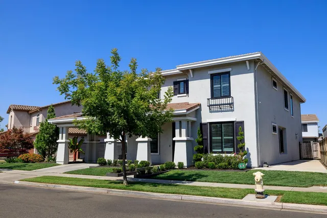 a front view of a house with a garage