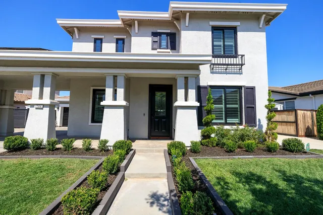 a living room with furniture and stairs