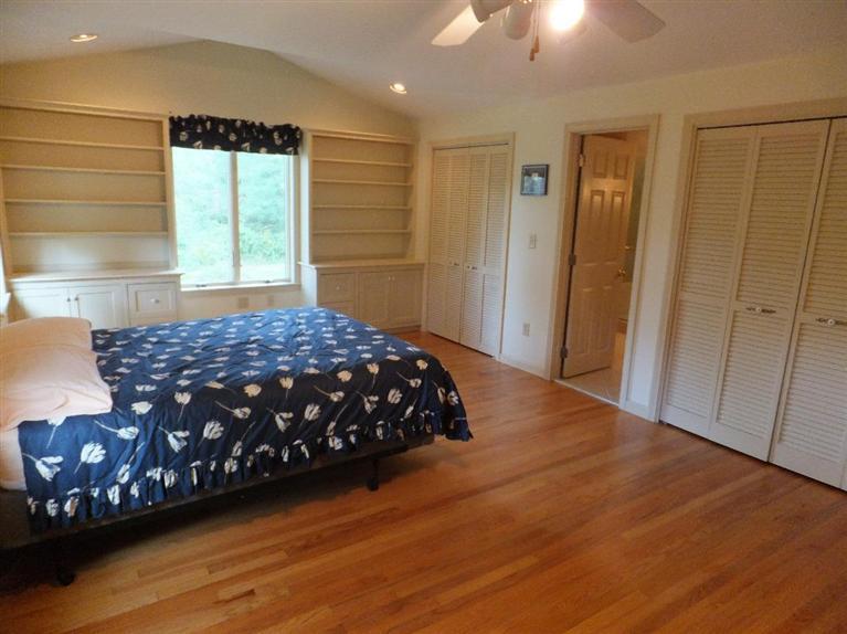14 Brick Hill Road Orleans, MA 02653 - Photo 13 of 27 a bedroom with a bed dresser and a window