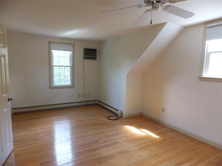 14 Brick Hill Road Orleans, MA 02653 - Photo 16 of 27 wooden floor in an empty room with a window