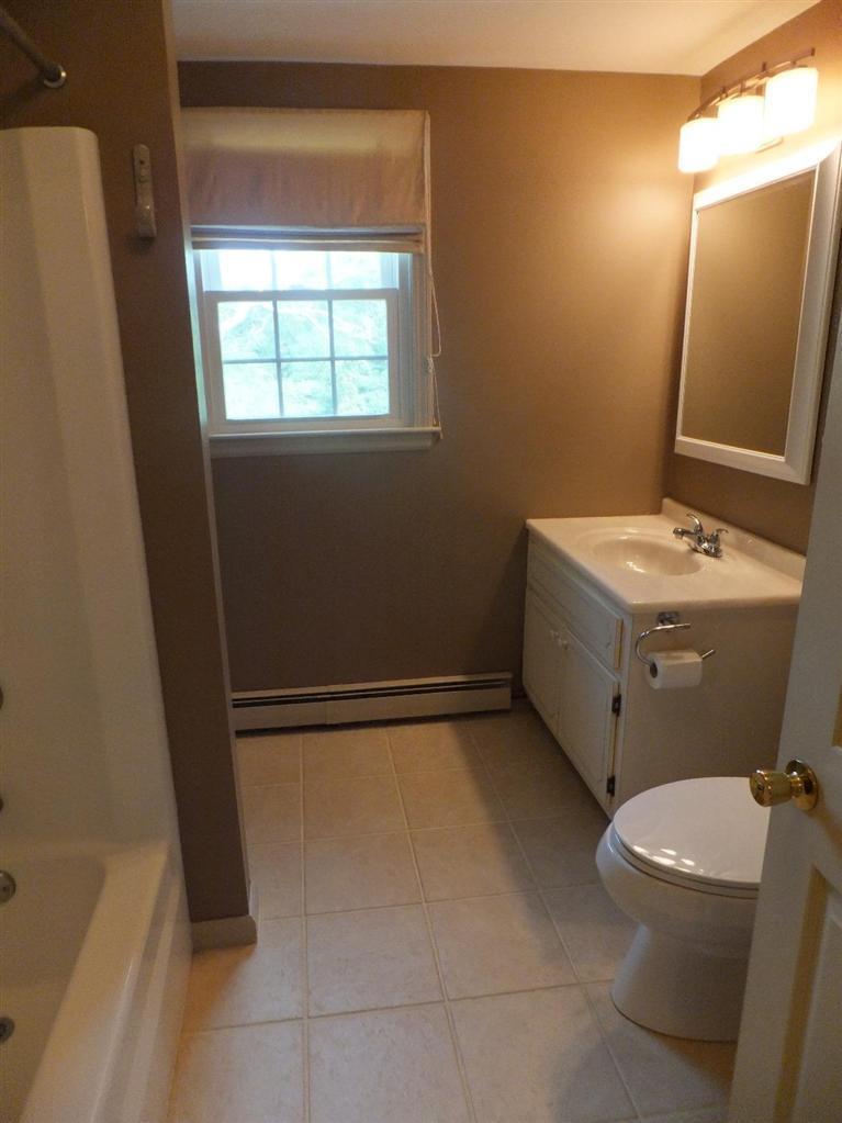 14 Brick Hill Road Orleans, MA 02653 - Photo 17 of 27 a bathroom with a sink a toilet and a mirror