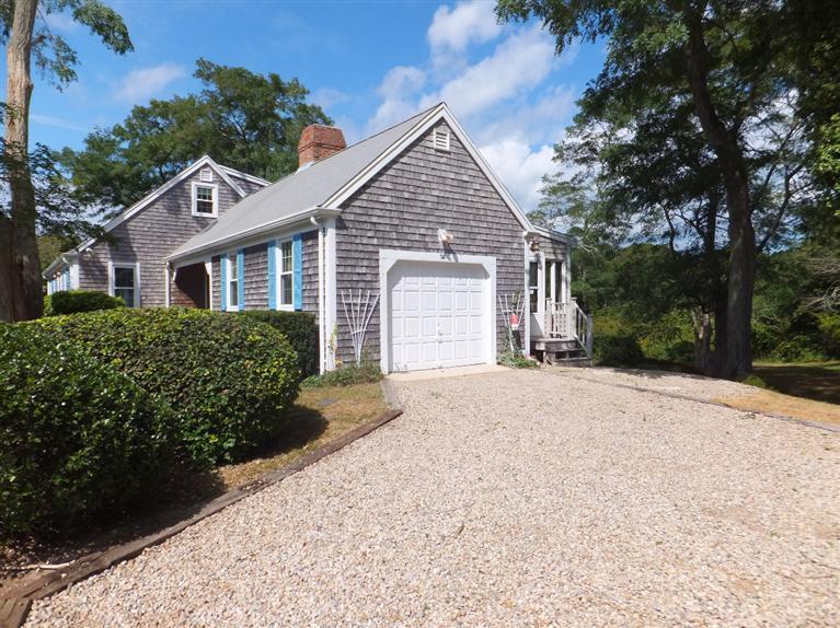 14 Brick Hill Road Orleans, MA 02653 - Photo 2 of 27 a view of a house with a yard and garage