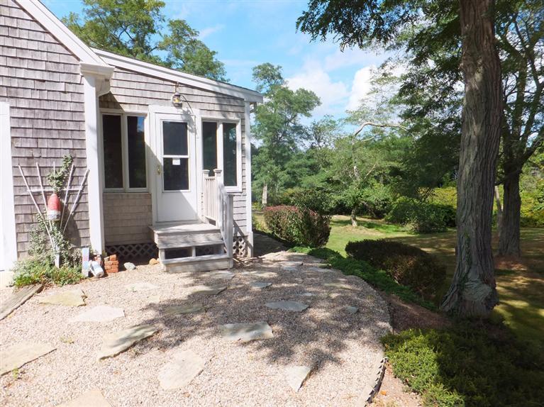 14 Brick Hill Road Orleans, MA 02653 - Photo 21 of 27 a view of a house with backyard and sitting area