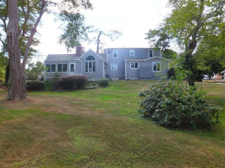 14 Brick Hill Road Orleans, MA 02653 - Photo 25 of 27 a view of a house with a yard and a garden