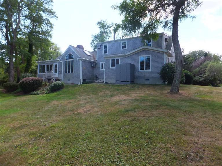 14 Brick Hill Road Orleans, MA 02653 - Photo 26 of 27 a front view of a house with a garden