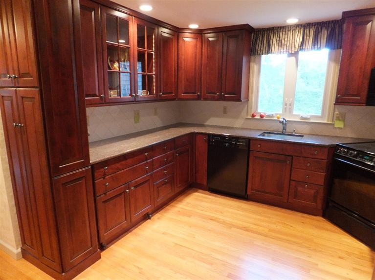 14 Brick Hill Road Orleans, MA 02653 - Photo 6 of 27 a kitchen with stainless steel appliances granite countertop cabinets and window