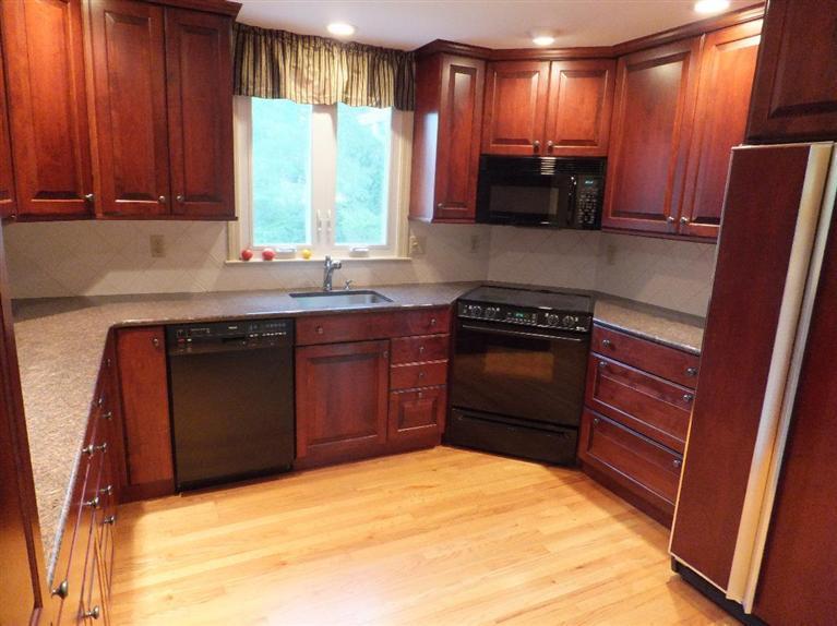 14 Brick Hill Road Orleans, MA 02653 - Photo 7 of 27 a kitchen with a window a sink and a stove