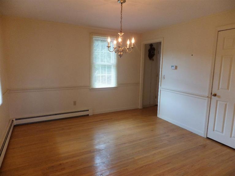 14 Brick Hill Road Orleans, MA 02653 - Photo 8 of 27 a view of an empty room with wooden floor and a window