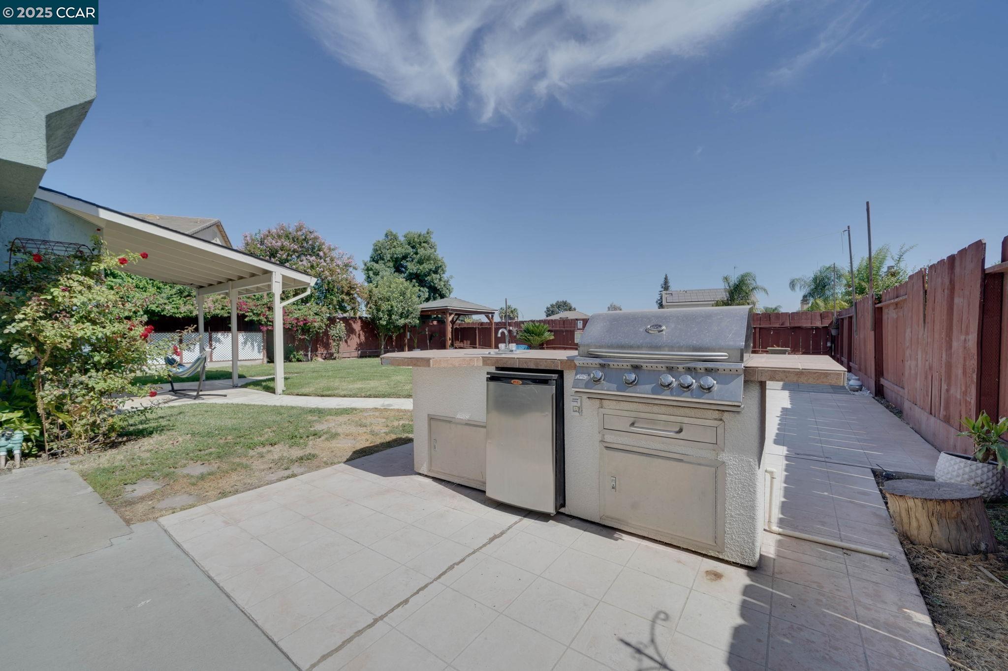 1210 Snow Ridge Court Modesto, CA 95351 - Photo 20 of 43 a view of a kitchen with utility room
