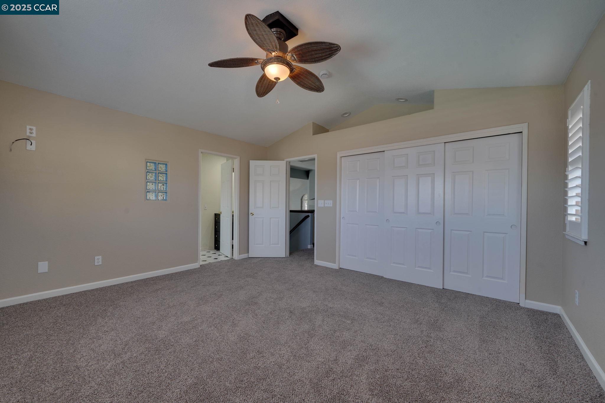 1210 Snow Ridge Court Modesto, CA 95351 - Photo 27 of 43 a view of an empty room with a ceiling fan
