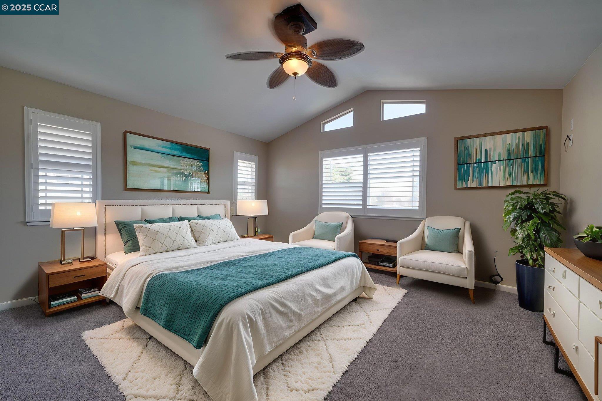 1210 Snow Ridge Court Modesto, CA 95351 - Photo 30 of 43 a bedroom with a bed couches chair and a chandelier