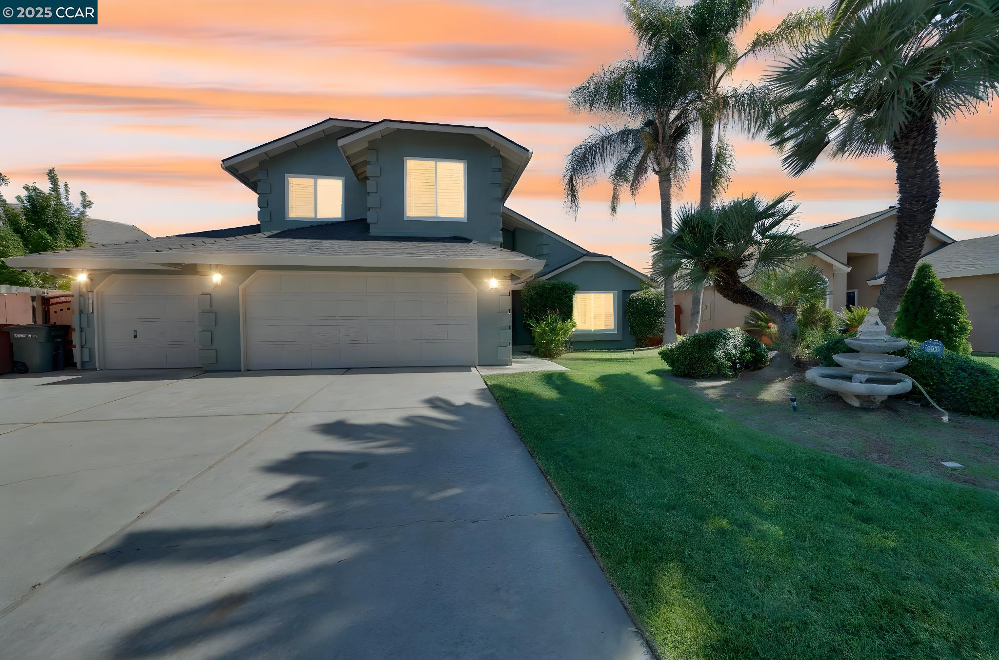 1210 Snow Ridge Court Modesto, CA 95351 - Photo 3 of 43 a front view of a house with a garden