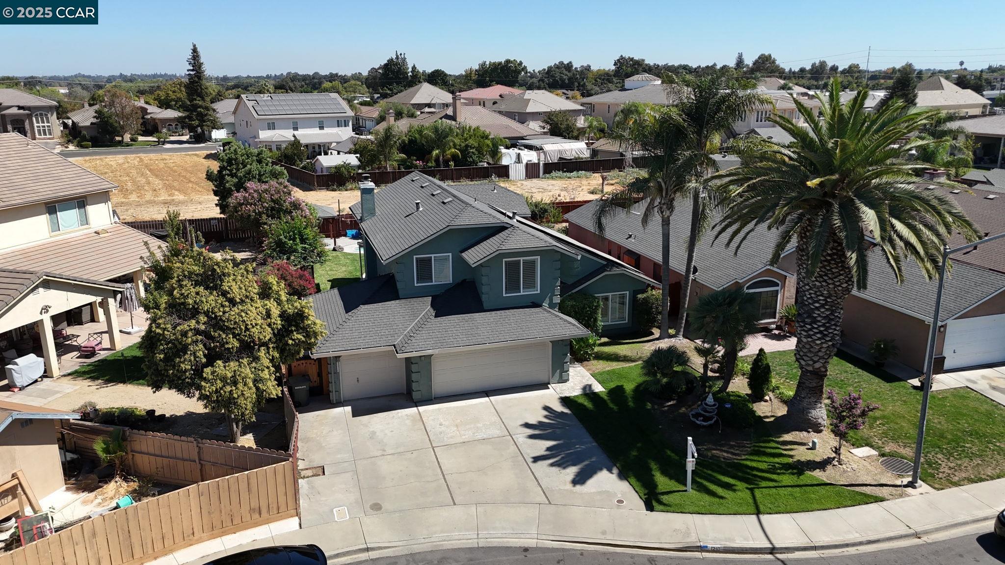 1210 Snow Ridge Court Modesto, CA 95351 - Photo 40 of 43 an aerial view of a house with garden space and houses