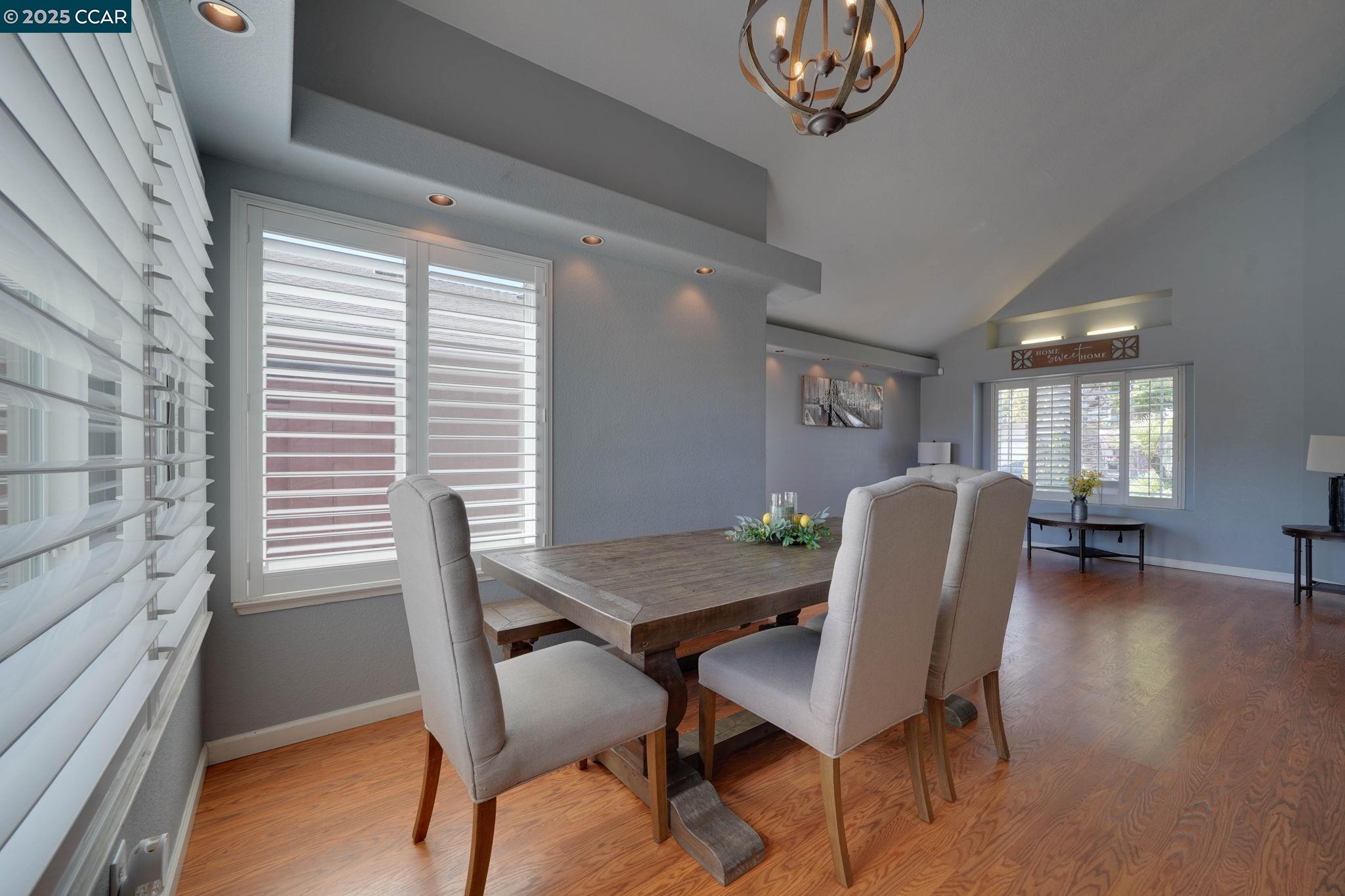 1210 Snow Ridge Court Modesto, CA 95351 - Photo 7 of 43 a view of a dining room with furniture and a window