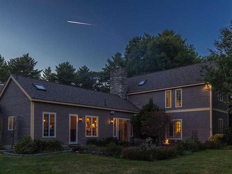 36 Brookside Drive Woolwich, ME 04579 - Photo 9 of 35 Exterior Side View. Dusk view across...