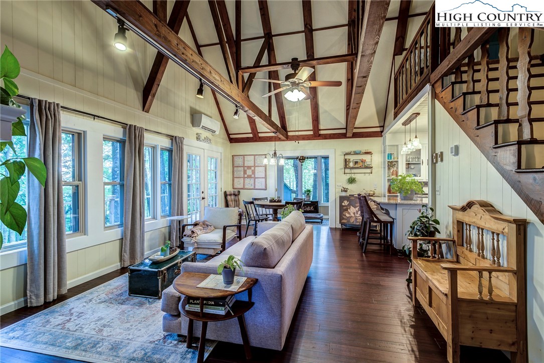 528 Bear Ridge Trail Fleetwood, NC 28626 - Photo 11 of 44 a living room with furniture a couch and potted plant with wooden floor