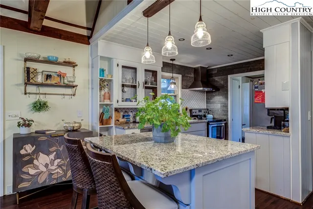 a bathroom with a sink vanity and toilet