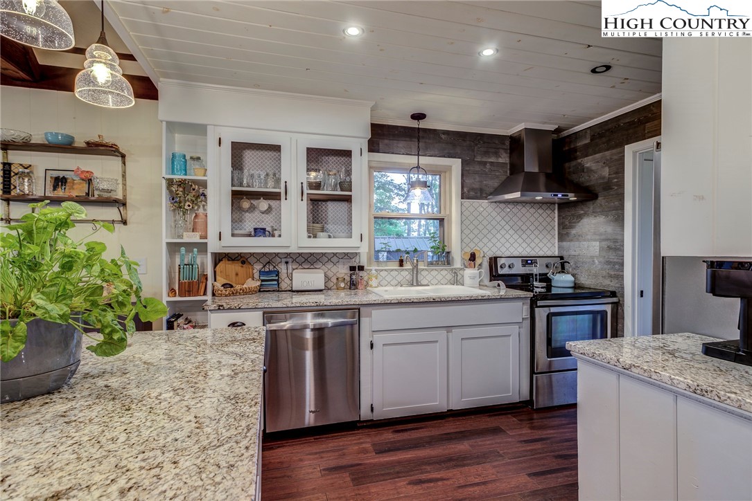 528 Bear Ridge Trail Fleetwood, NC 28626 - Photo 17 of 44 a kitchen with a sink stainless steel appliances and cabinets