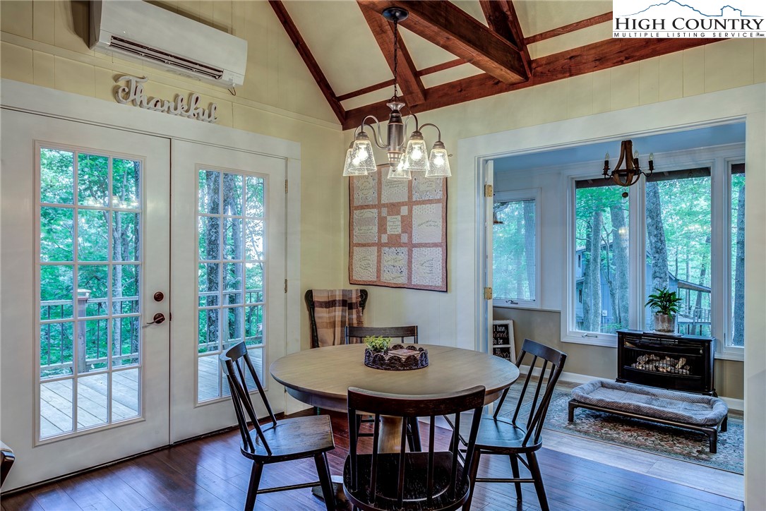 528 Bear Ridge Trail Fleetwood, NC 28626 - Photo 24 of 44 a view of a dining room with furniture window and wooden floor