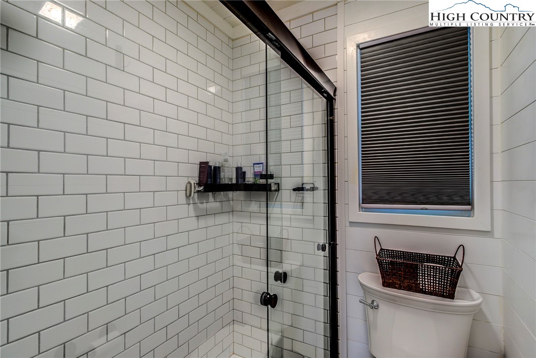 528 Bear Ridge Trail Fleetwood, NC 28626 - Photo 29 of 44 a bathroom with a shower