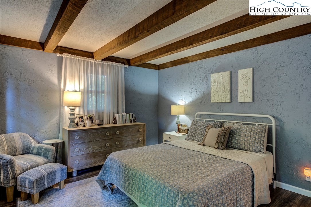 528 Bear Ridge Trail Fleetwood, NC 28626 - Photo 30 of 44 a bedroom with a bed and window