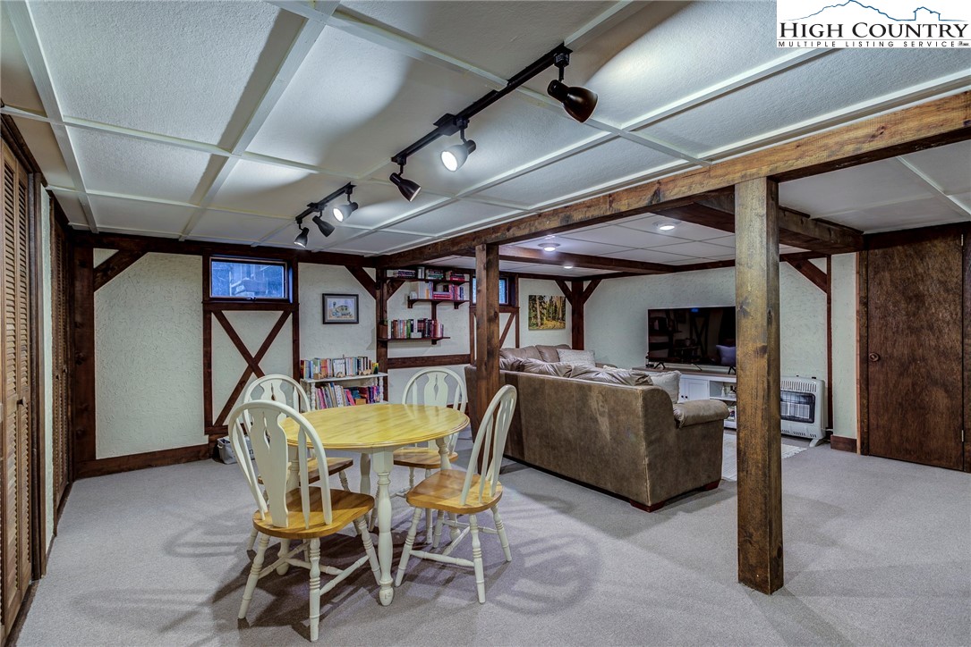 528 Bear Ridge Trail Fleetwood, NC 28626 - Photo 40 of 44 a dining room with furniture and a rug