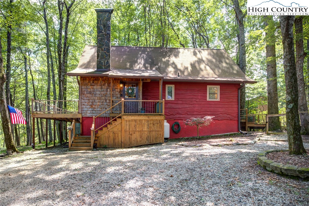 528 Bear Ridge Trail Fleetwood, NC 28626 - Photo 4 of 44 a front view of a house with a yard