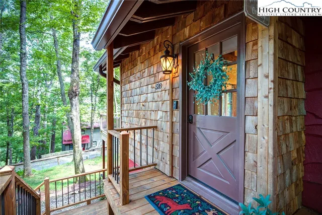 a kitchen with stainless steel appliances granite countertop a sink a stove and a wooden floors