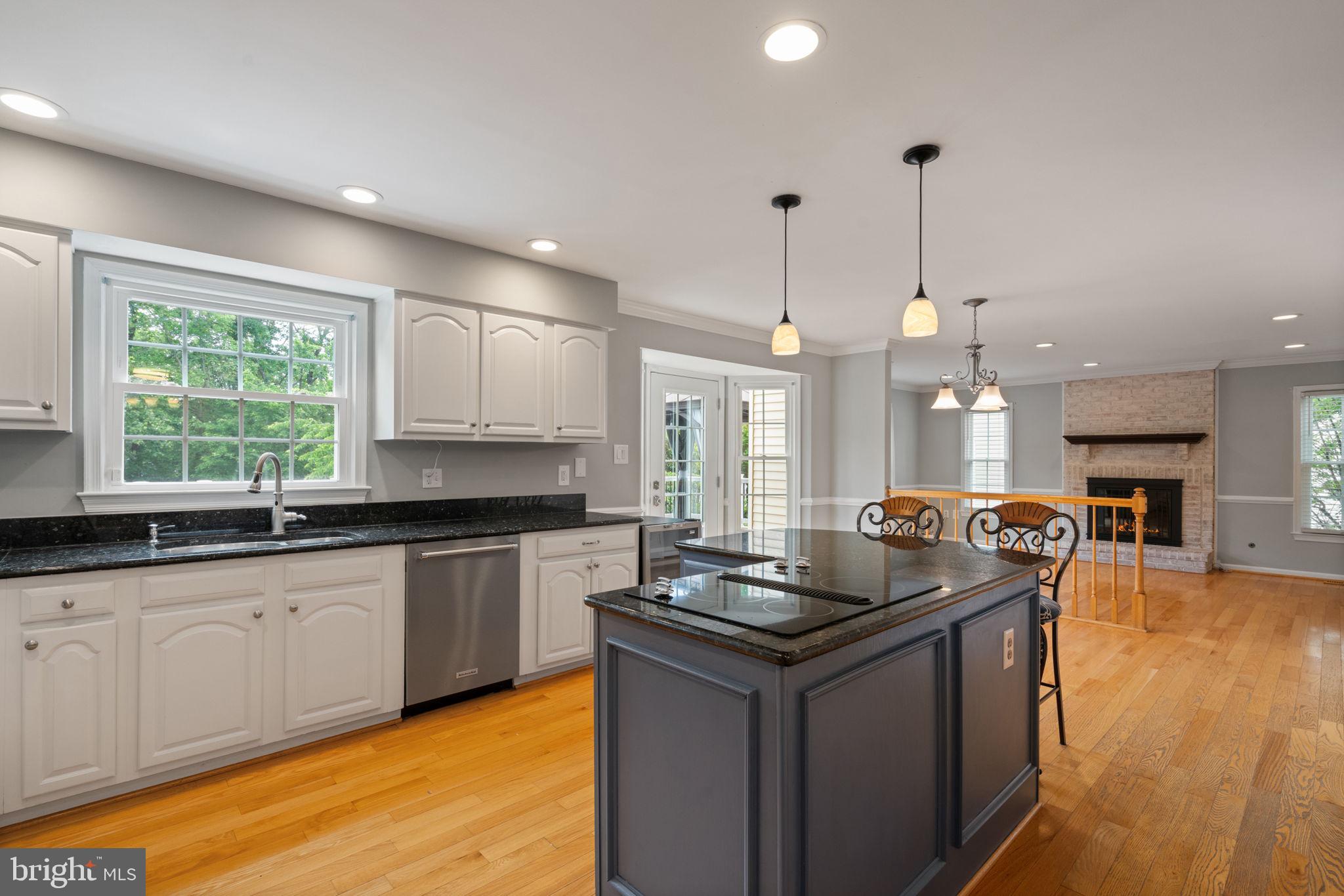 8527 Silverview Drive Lorton, VA 22079 - Photo 42 of 63 a kitchen with granite countertop a sink a counter top space appliances and cabinets