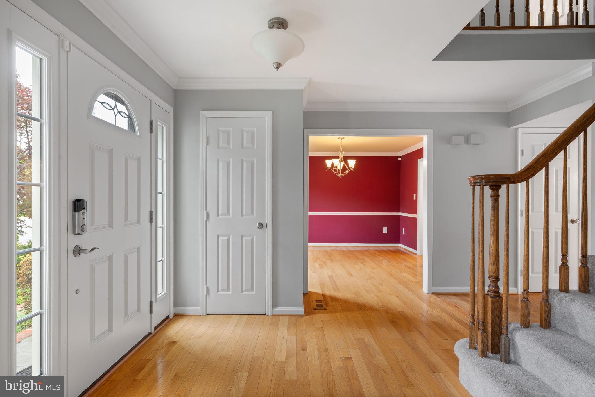 8527 Silverview Drive Lorton, VA 22079 - Photo 49 of 63 a view of a room with wooden floor door and stairs