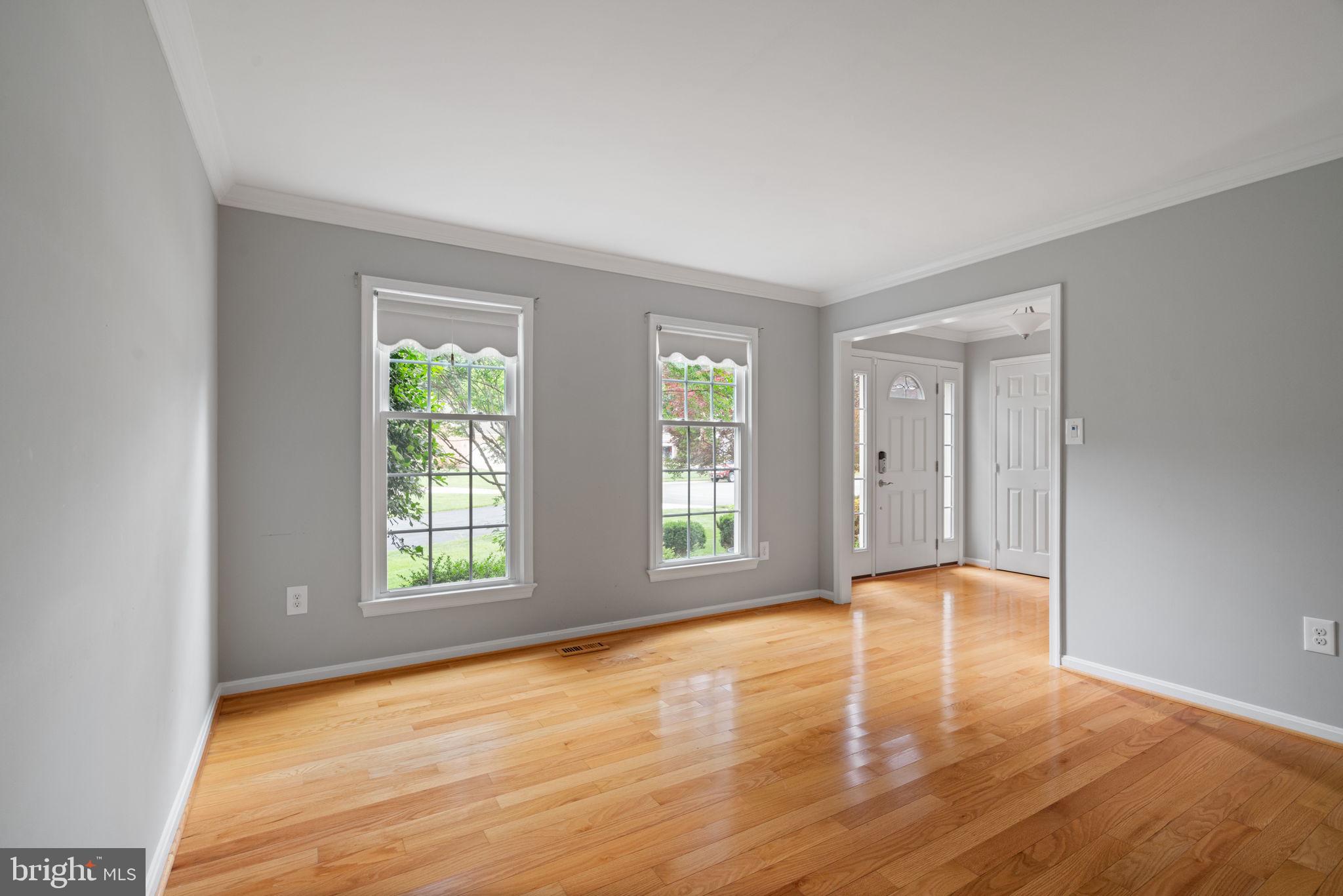 8527 Silverview Drive Lorton, VA 22079 - Photo 51 of 63 an empty room with wooden floor and windows