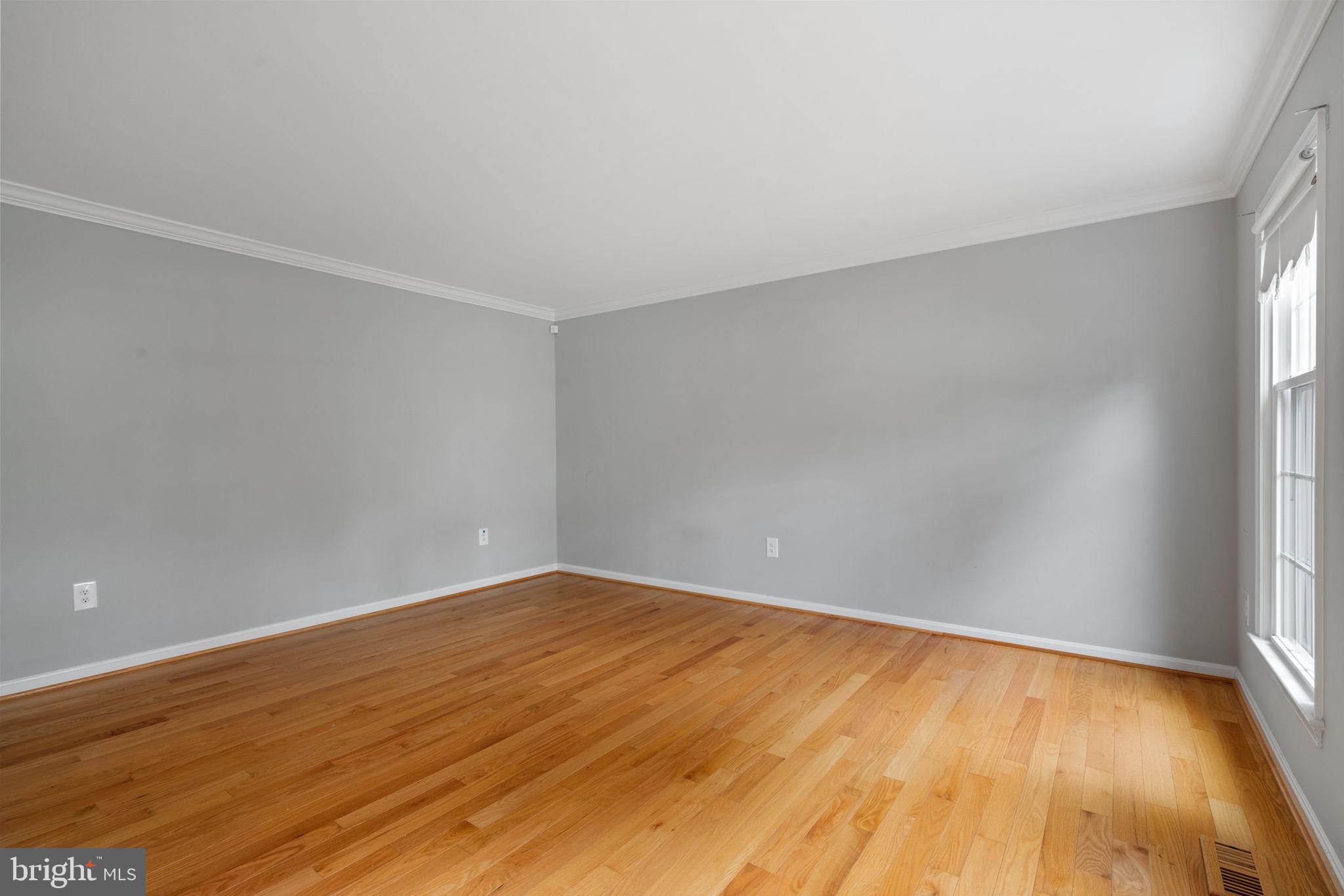 8527 Silverview Drive Lorton, VA 22079 - Photo 52 of 63 an empty room with wooden floor and windows