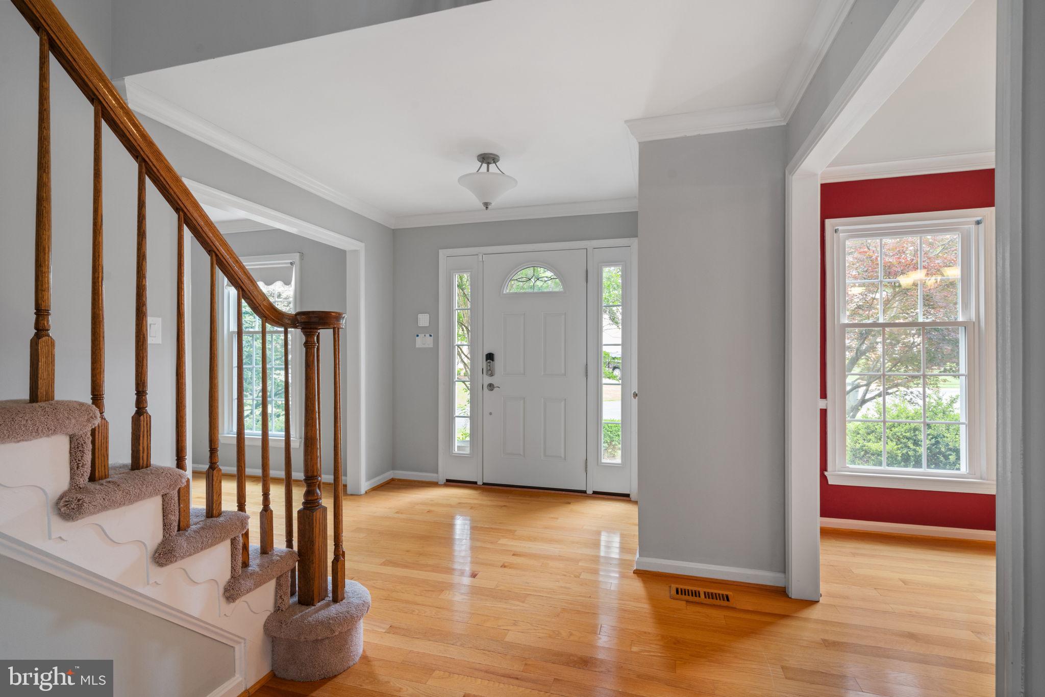 8527 Silverview Drive Lorton, VA 22079 - Photo 53 of 63 a view of an entryway with wooden floor and windows