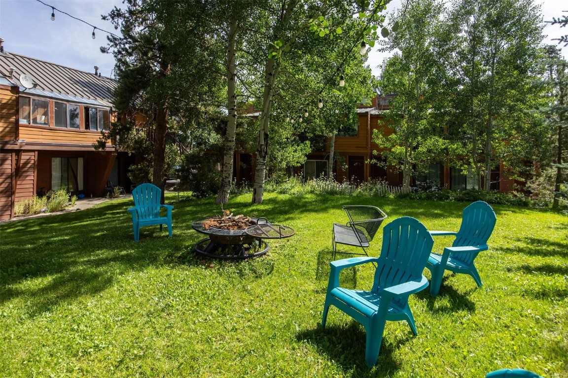 510 Pitkin Street, Unit C4 Frisco, CO 80443 - Photo 31 of 41 a view of a chair and table in backyard of the house
