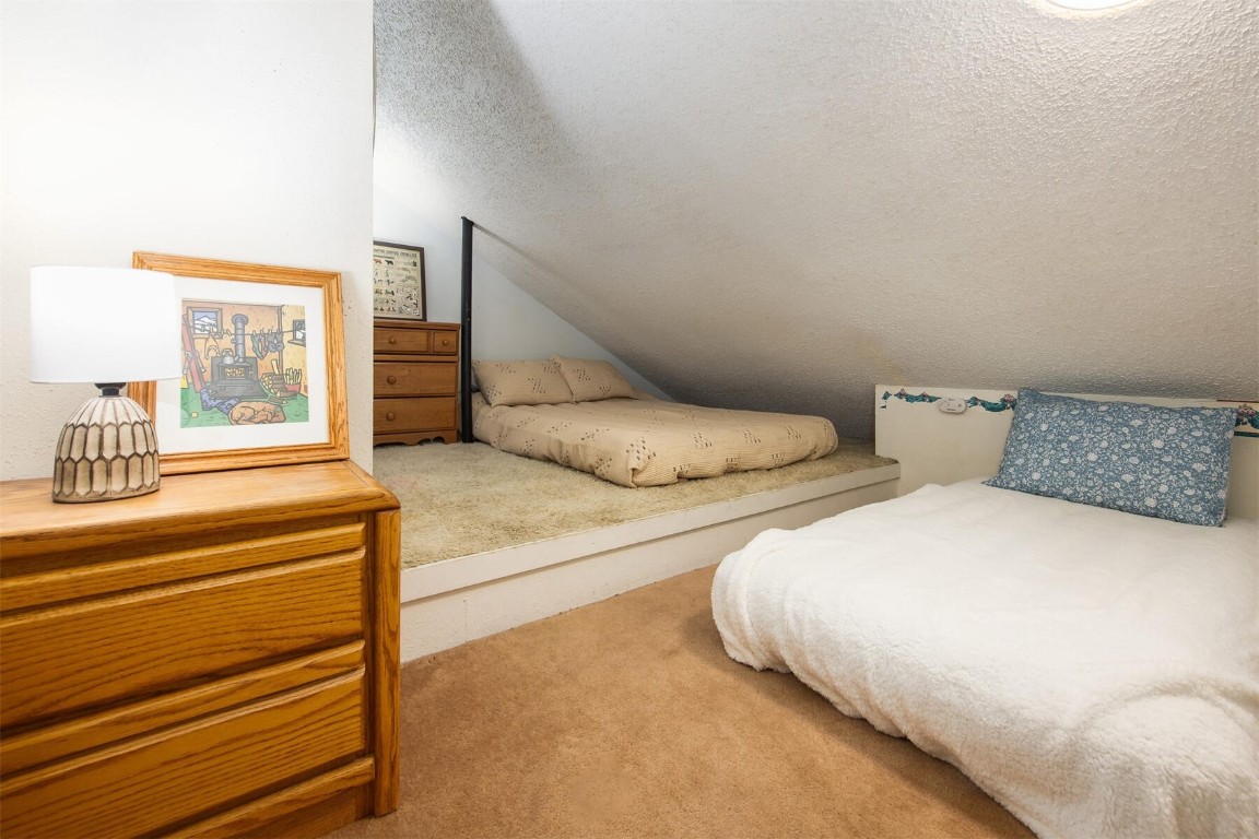 510 Pitkin Street, Unit C4 Frisco, CO 80443 - Photo 8 of 41 a bedroom with two beds and painting on the wall