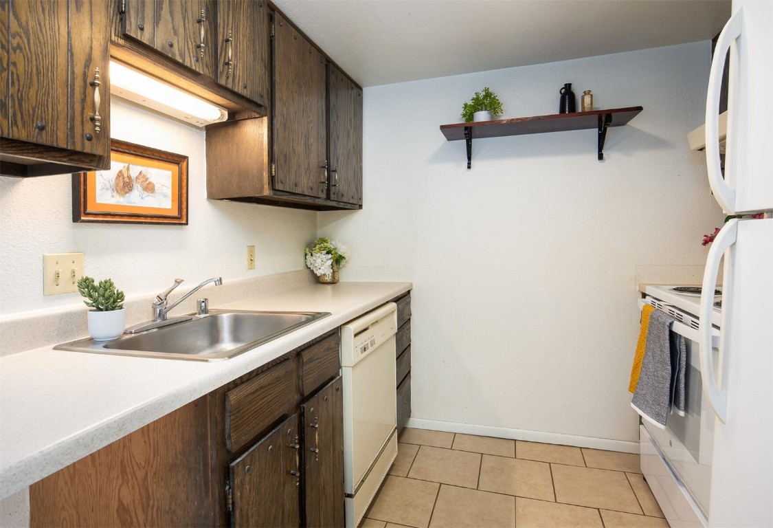 510 Pitkin Street, Unit C4 Frisco, CO 80443 - Photo 9 of 41 a kitchen with a sink cabinets and stainless steel appliances
