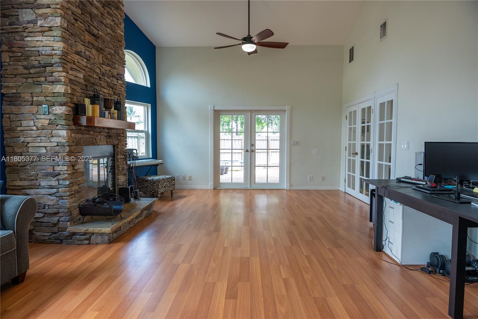 19663 Hampton Drive Boca Raton, FL 33434 - Photo 11 of 33 a view of a livingroom with furniture and a flat screen tv