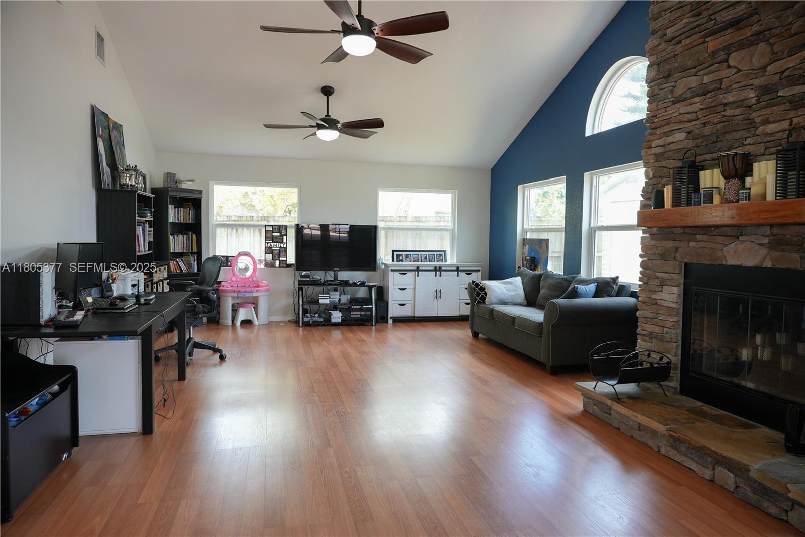 19663 Hampton Drive Boca Raton, FL 33434 - Photo 2 of 33 a living room with furniture and a fireplace