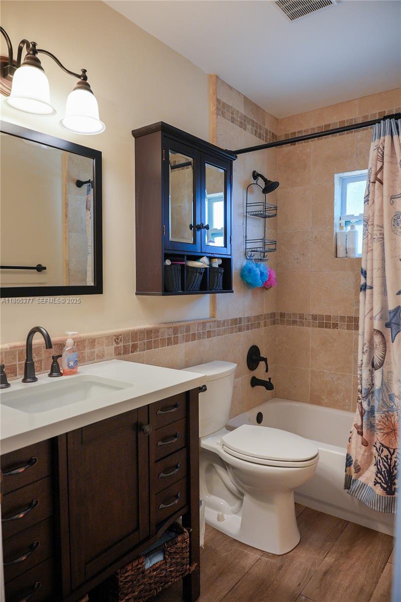 19663 Hampton Drive Boca Raton, FL 33434 - Photo 24 of 33 a bathroom with a toilet sink double vanity and mirror