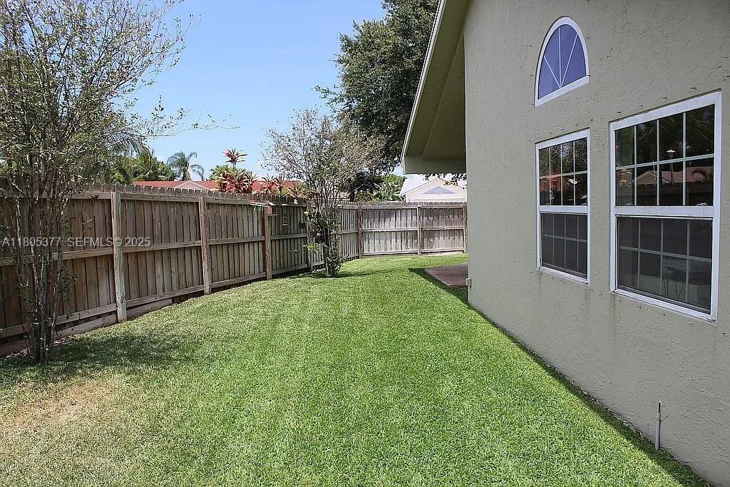 19663 Hampton Drive Boca Raton, FL 33434 - Photo 32 of 33 a view of backyard with deck and outdoor seating