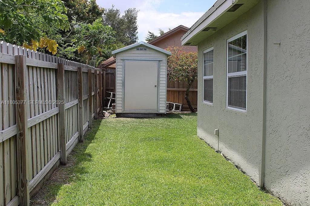 19663 Hampton Drive Boca Raton, FL 33434 - Photo 33 of 33 a view of an house with backyard and garden