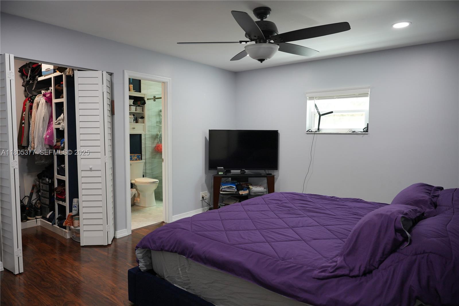 19663 Hampton Drive Boca Raton, FL 33434 - Photo 5 of 33 a bedroom with a bed and a flat screen tv