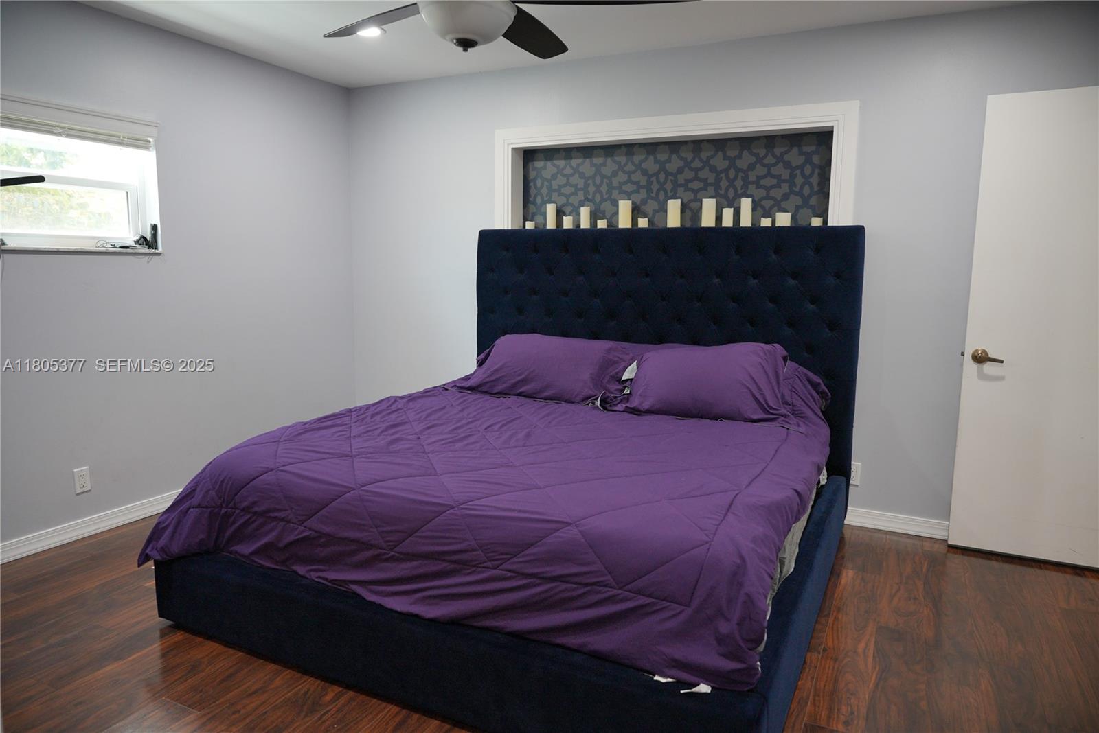 19663 Hampton Drive Boca Raton, FL 33434 - Photo 6 of 33 a bedroom with a bed and wooden floor