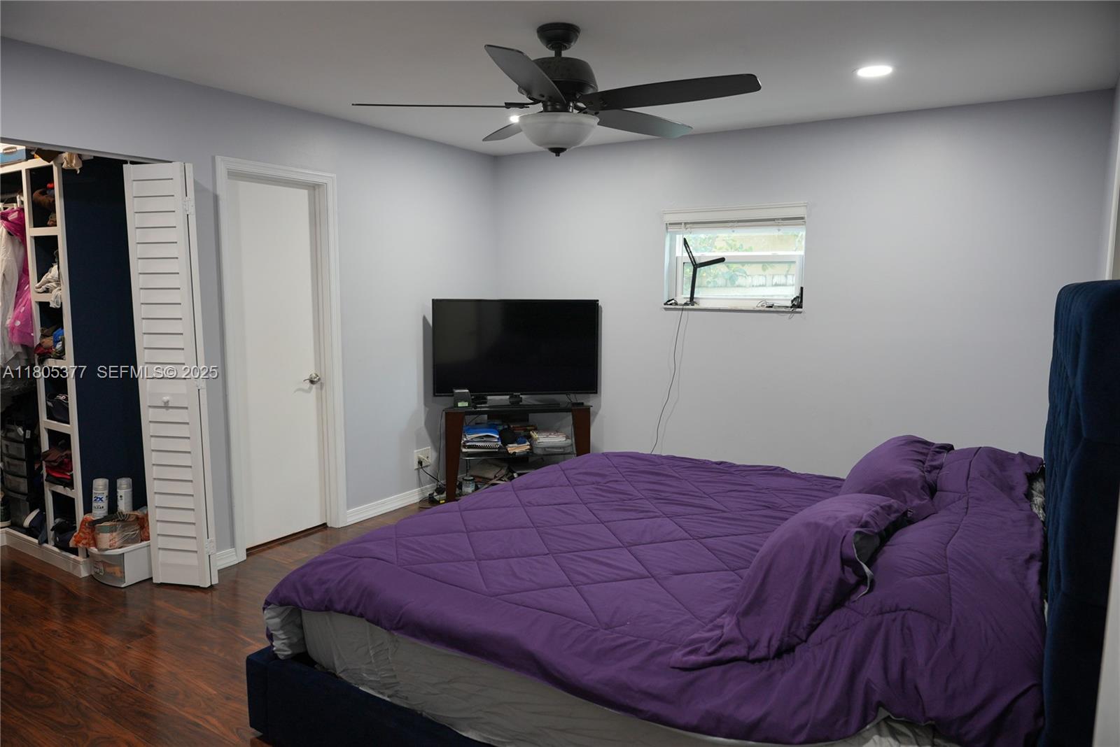 19663 Hampton Drive Boca Raton, FL 33434 - Photo 9 of 33 a bedroom with a bed and a flat screen tv