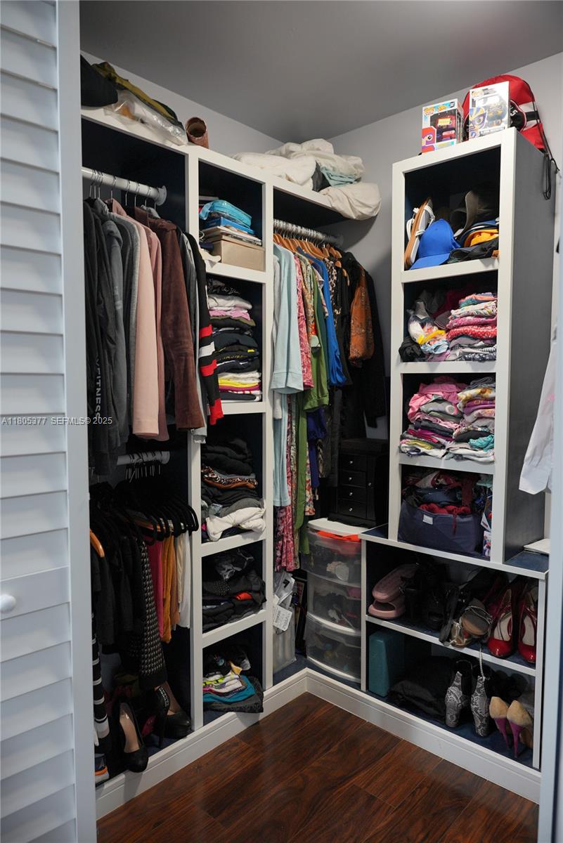 19663 Hampton Drive Boca Raton, FL 33434 - Photo 10 of 33 a view of walk in closet with clothes and shoes