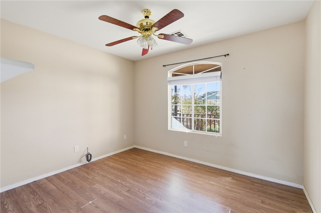 3740 North Kenneth Road Kingman, AZ 86409 - Photo 17 of 26 Empty room with light wood-type flooring and a ceiling fan