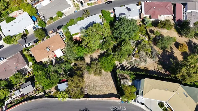 a view of a street with a fence
